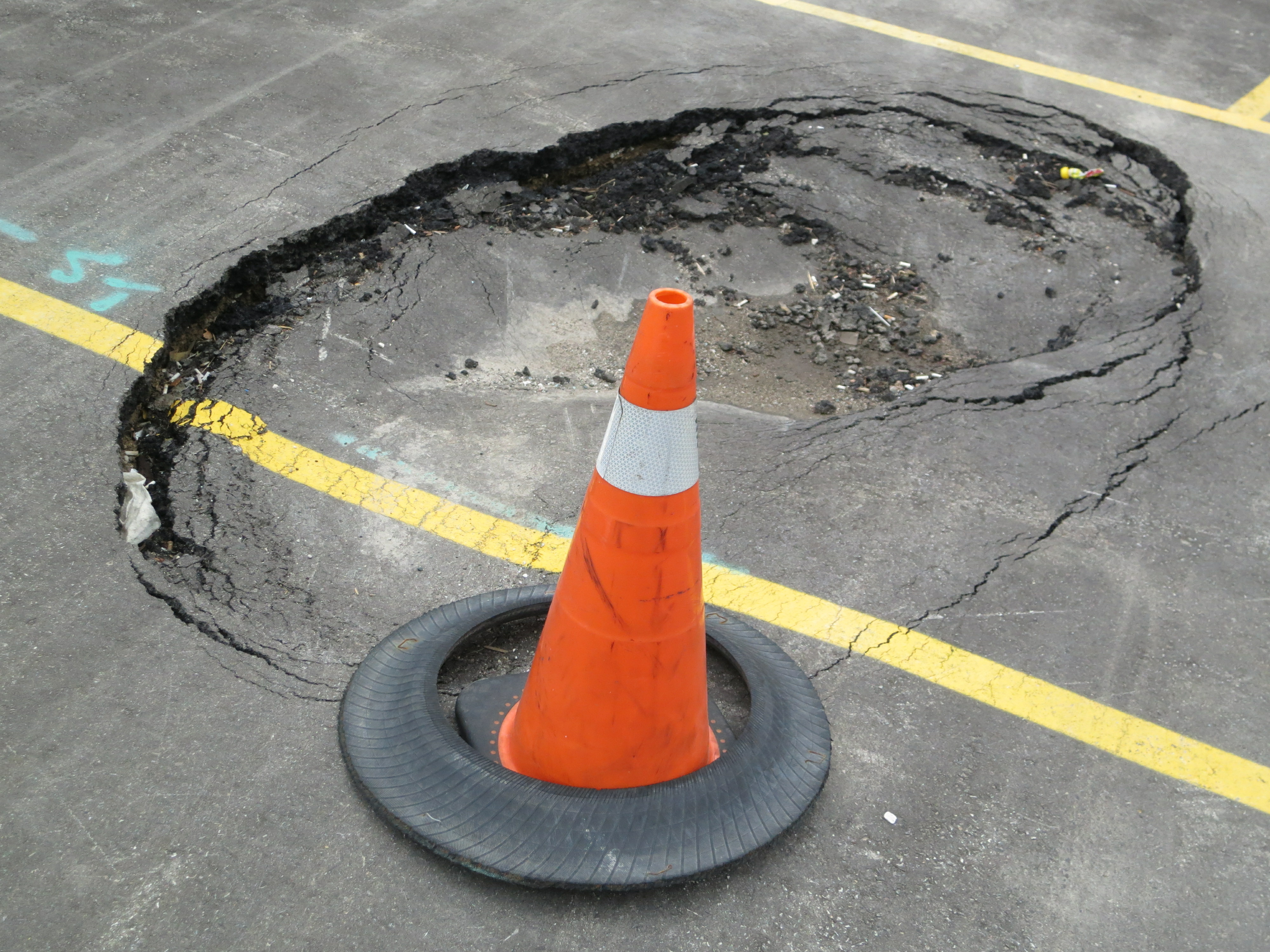 Potholes in Asphalt Parking Lot