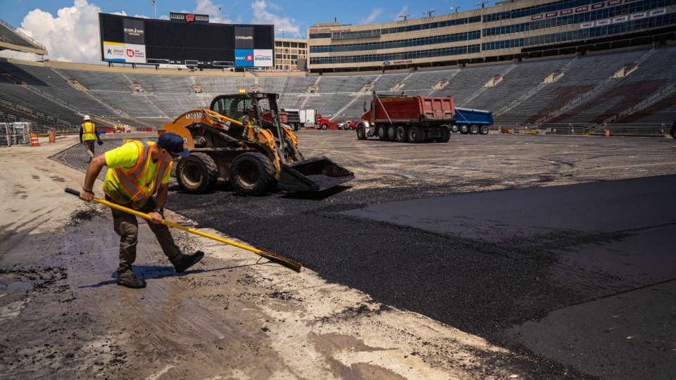 P+D Laborer Working on the South End Zone Paving Project at Camp Randall