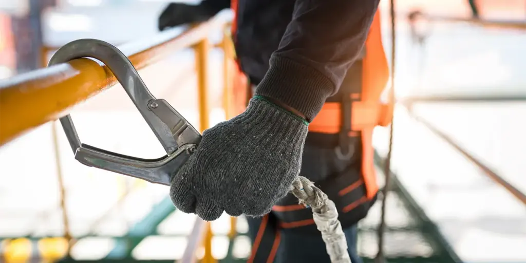 close up of construction worker with safety tether