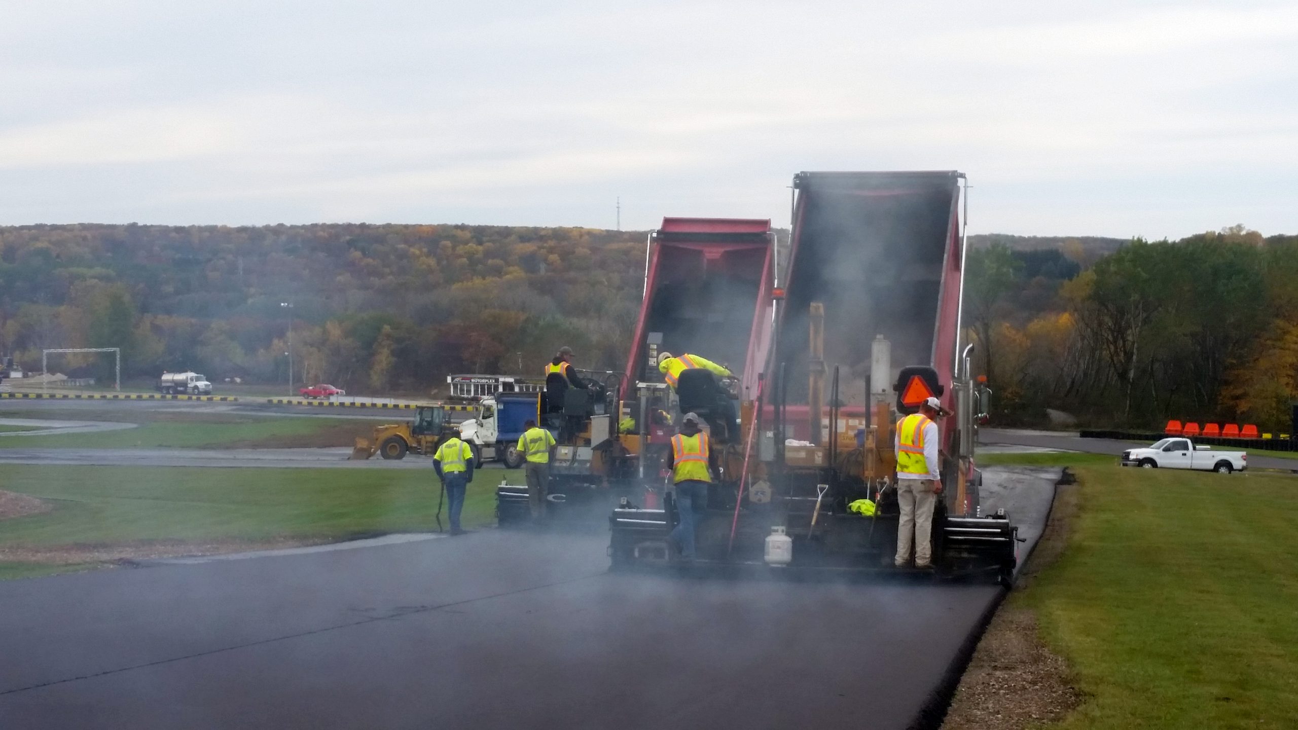 Hot asphalt being applied to Road of America Go-Cart Track