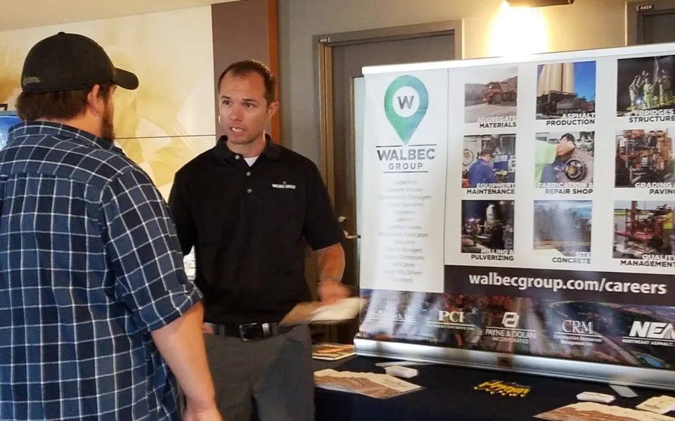 Walbec booth with men at convention