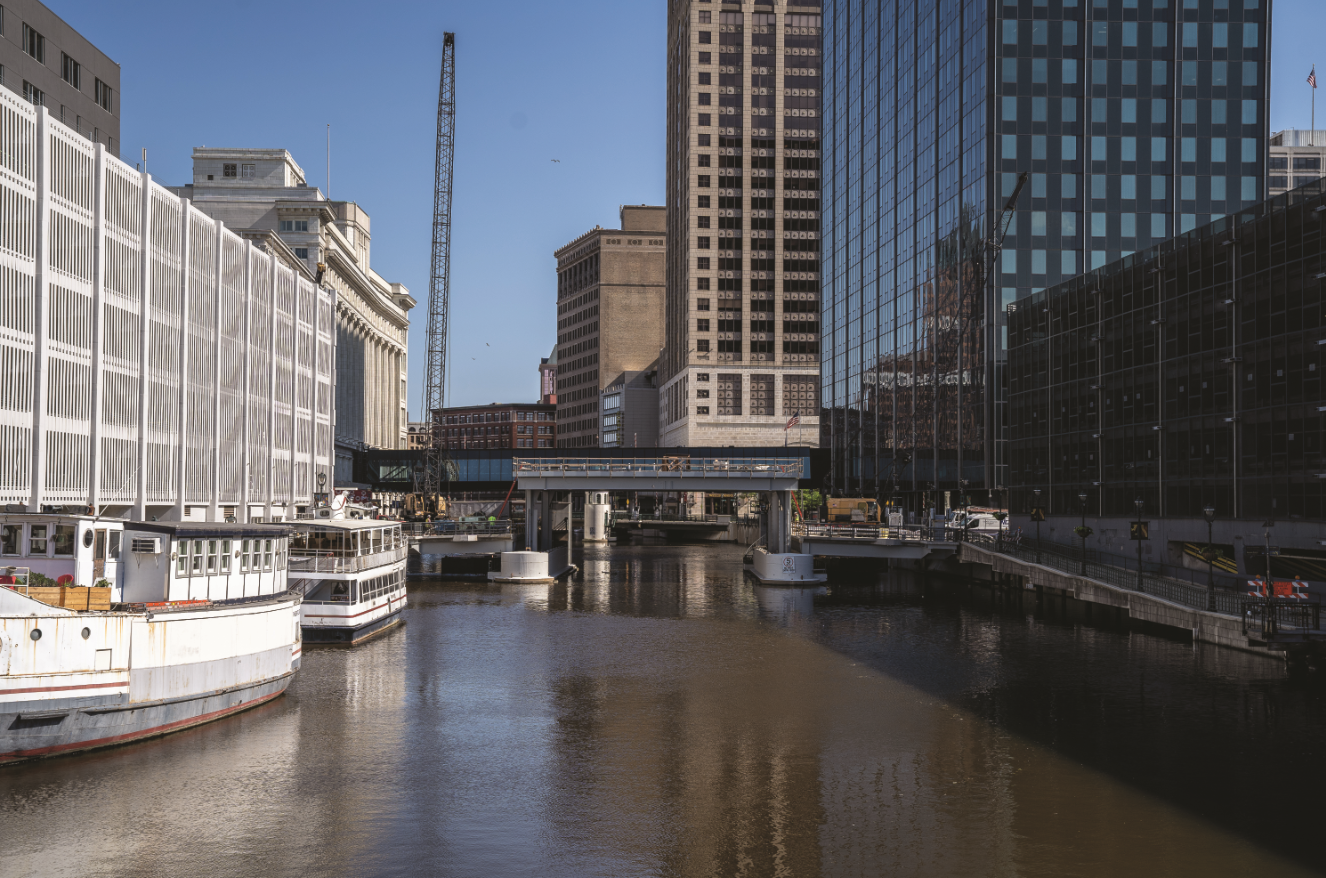 Drone shot over Milwaukee River showing rehabilitation process of the Michigan Street Vertical Lift Bridge