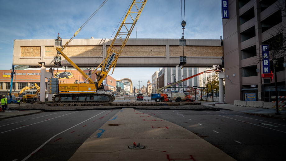 Wide shot of Wisconsin Center Skywalk being demolished