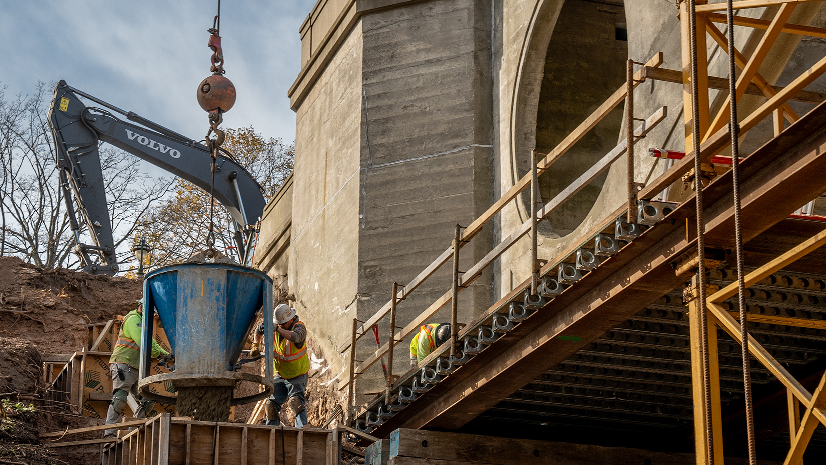 Side view close up concrete pouring at the Lake Park Arch Bridge (Ravine Road Bridge)