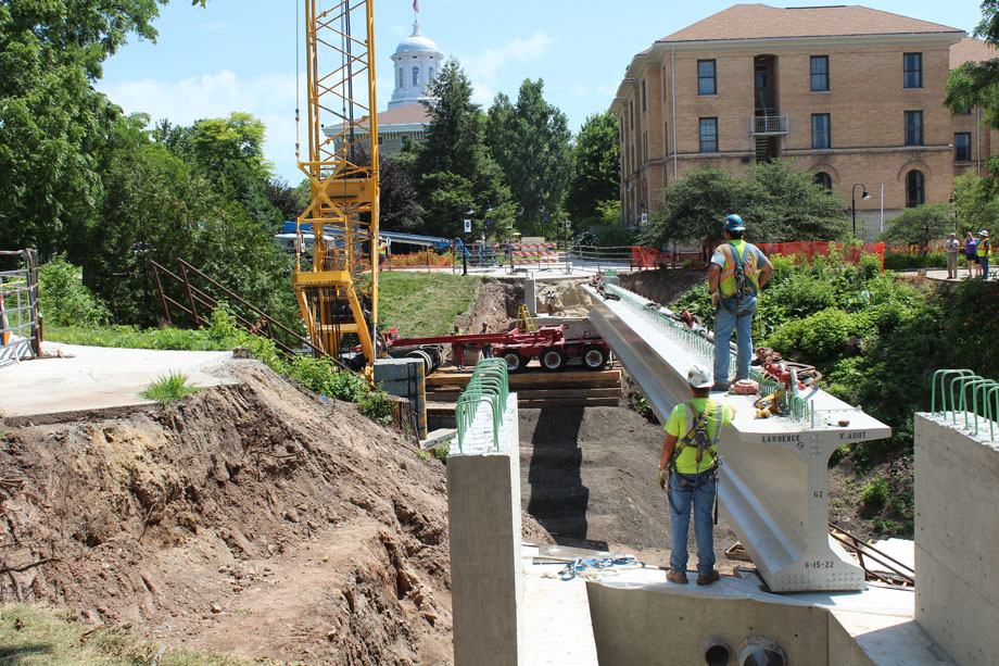 Work on top of construction beam at Lawrence University