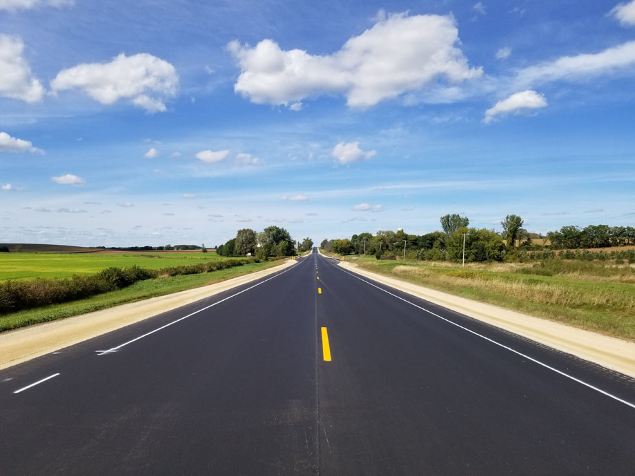 Wide shot of reconstructed STH 47, with the road in the center of the frame