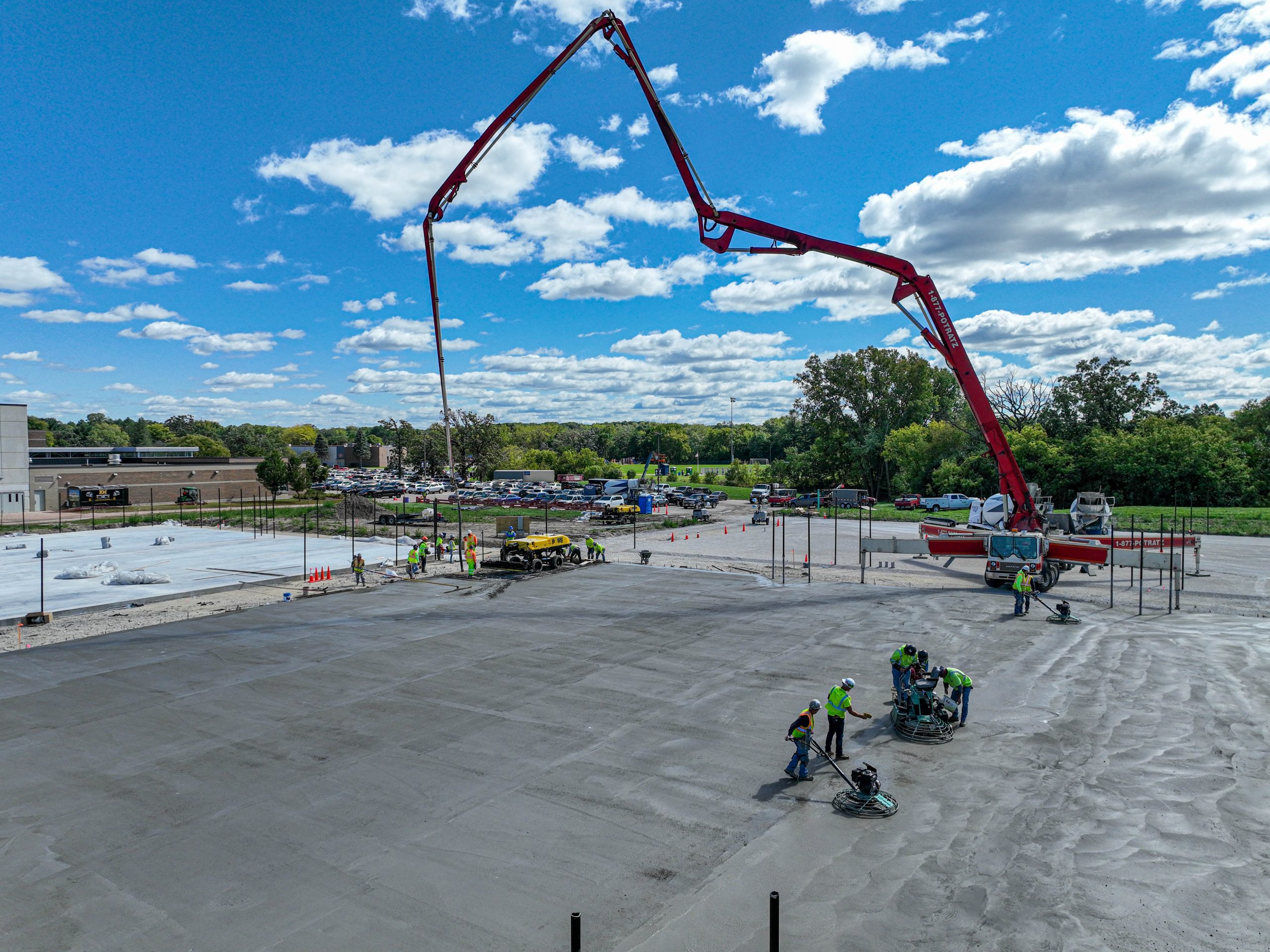 Group of workers leveling Kettle Moraine Tennis Courts