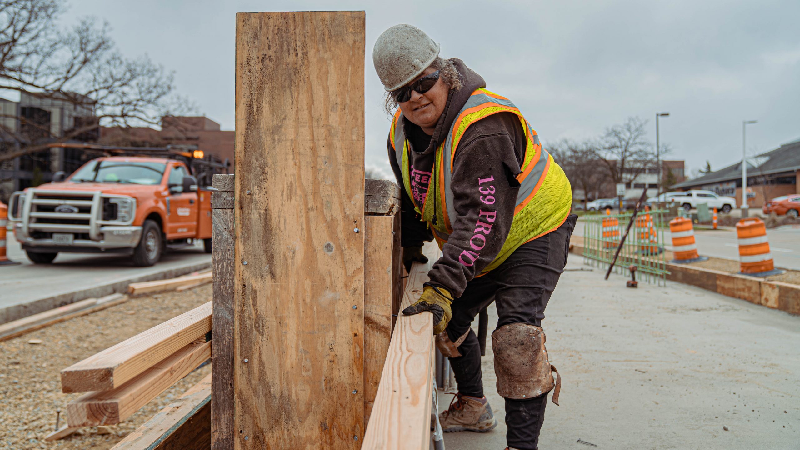 Female construction worker, working on Madison East-West Bus Rapid Transit