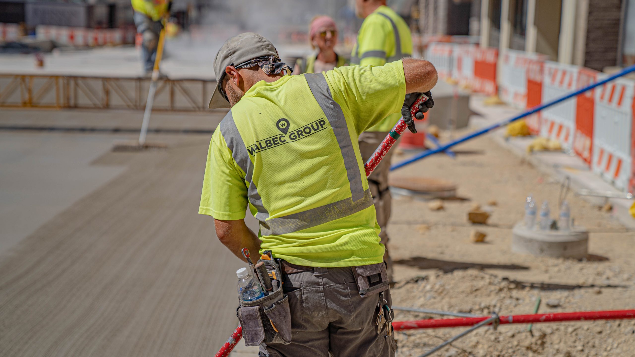 Group of Walbec Group workers leveling East Milwaukee Street