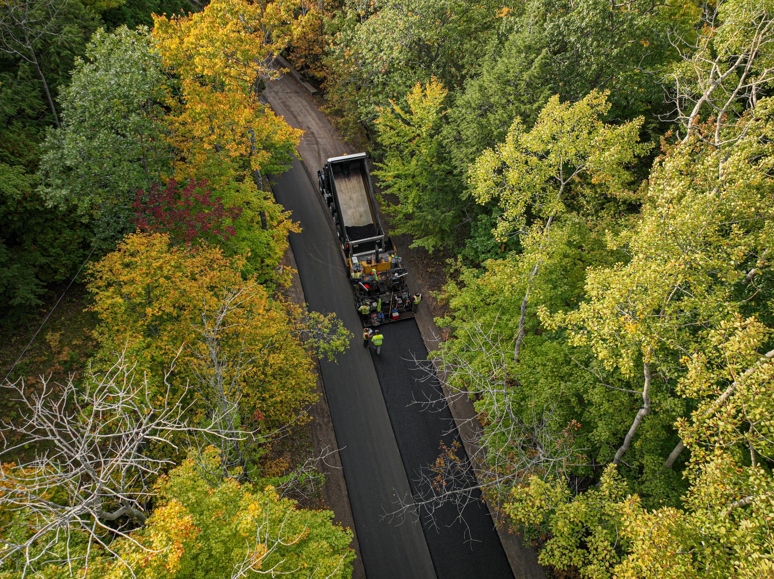Aerial view show asphalt pouring on Peninsula State Park Main Access Roads