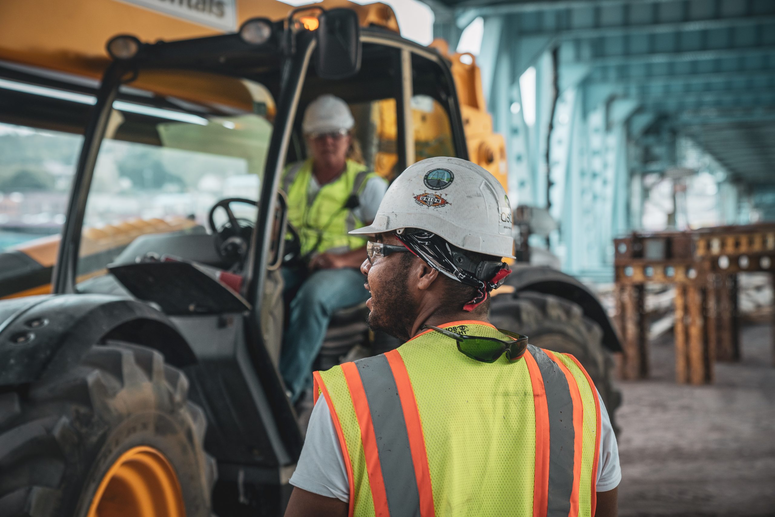 Close up of workers back under Portage Lake Lift Bridge