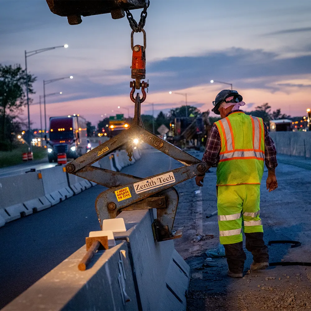 construction worker on jobsite at dusk