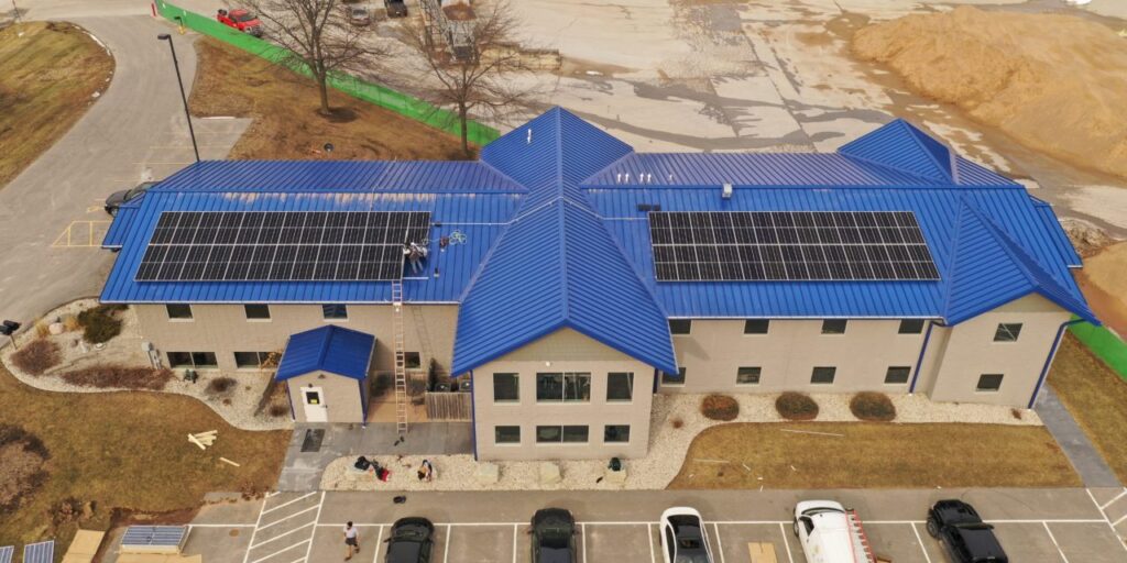 aerial view of building with solar panels
