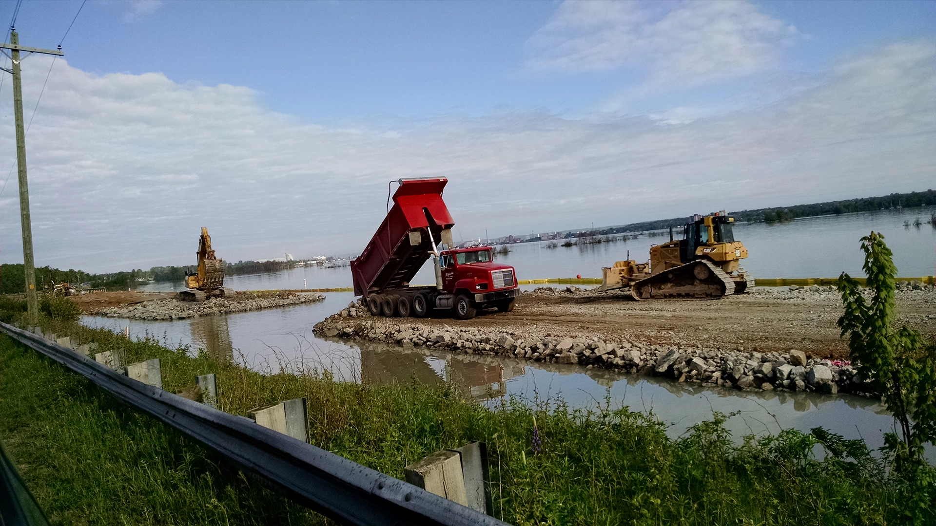 dump truck and excavators on jobsite