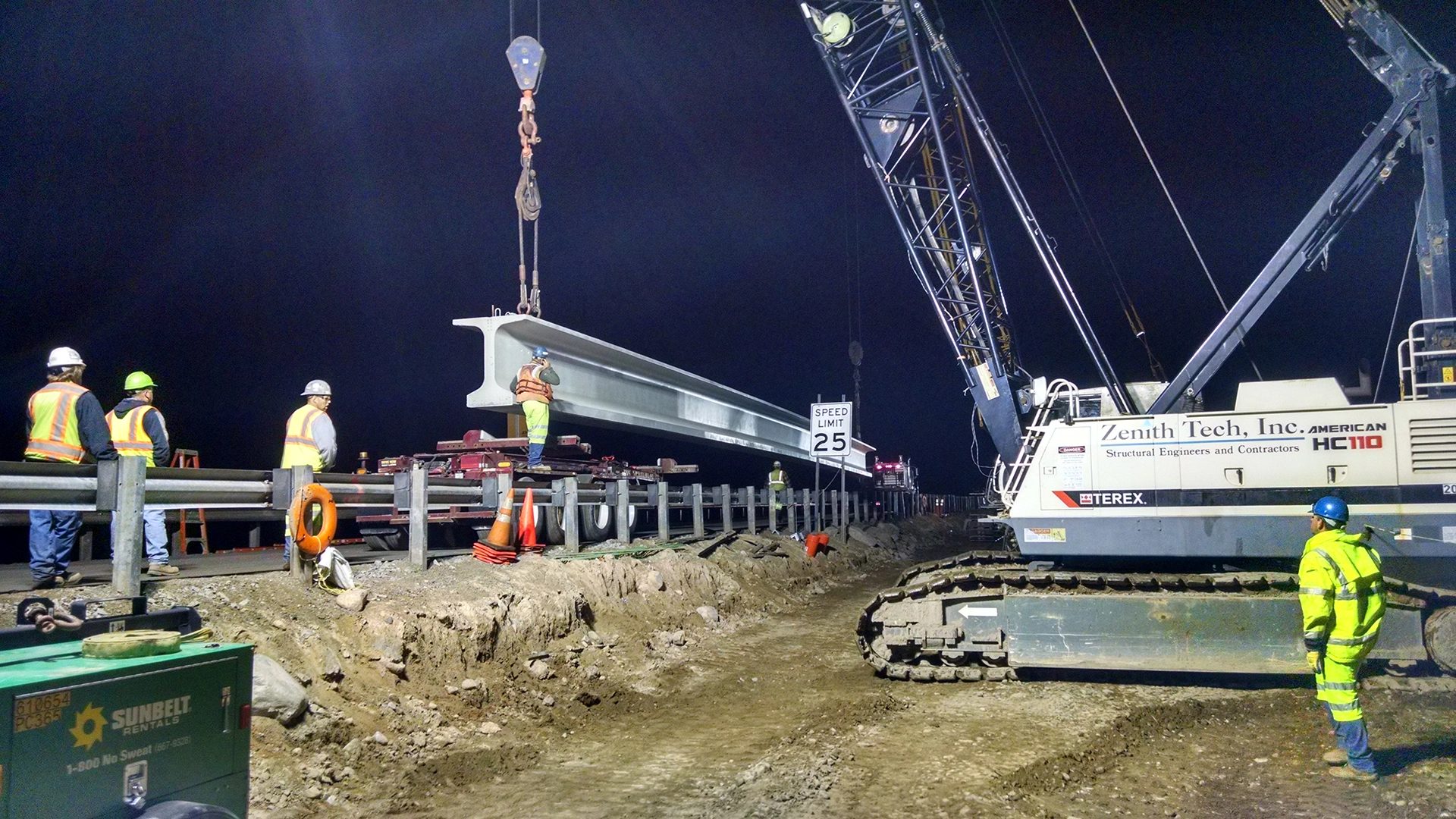 crane lifting beam at night