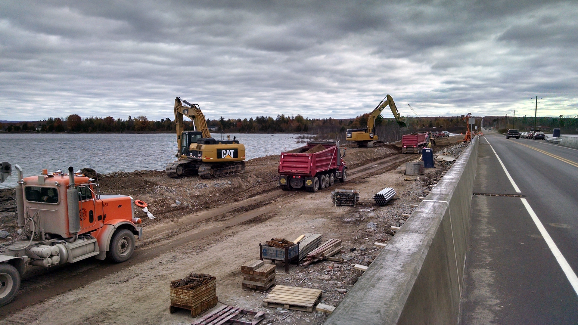 excavators and dump trucks removing dirt