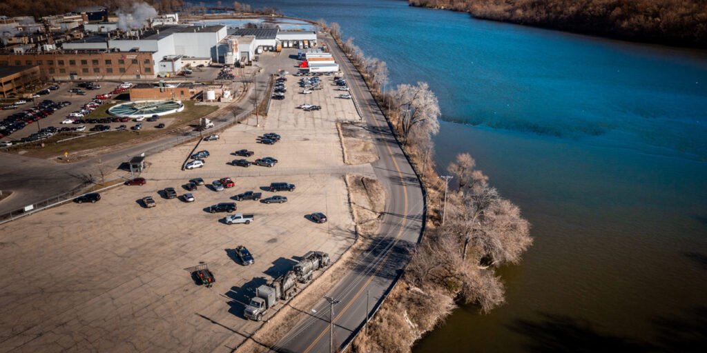 aerial view of parking lot next to river