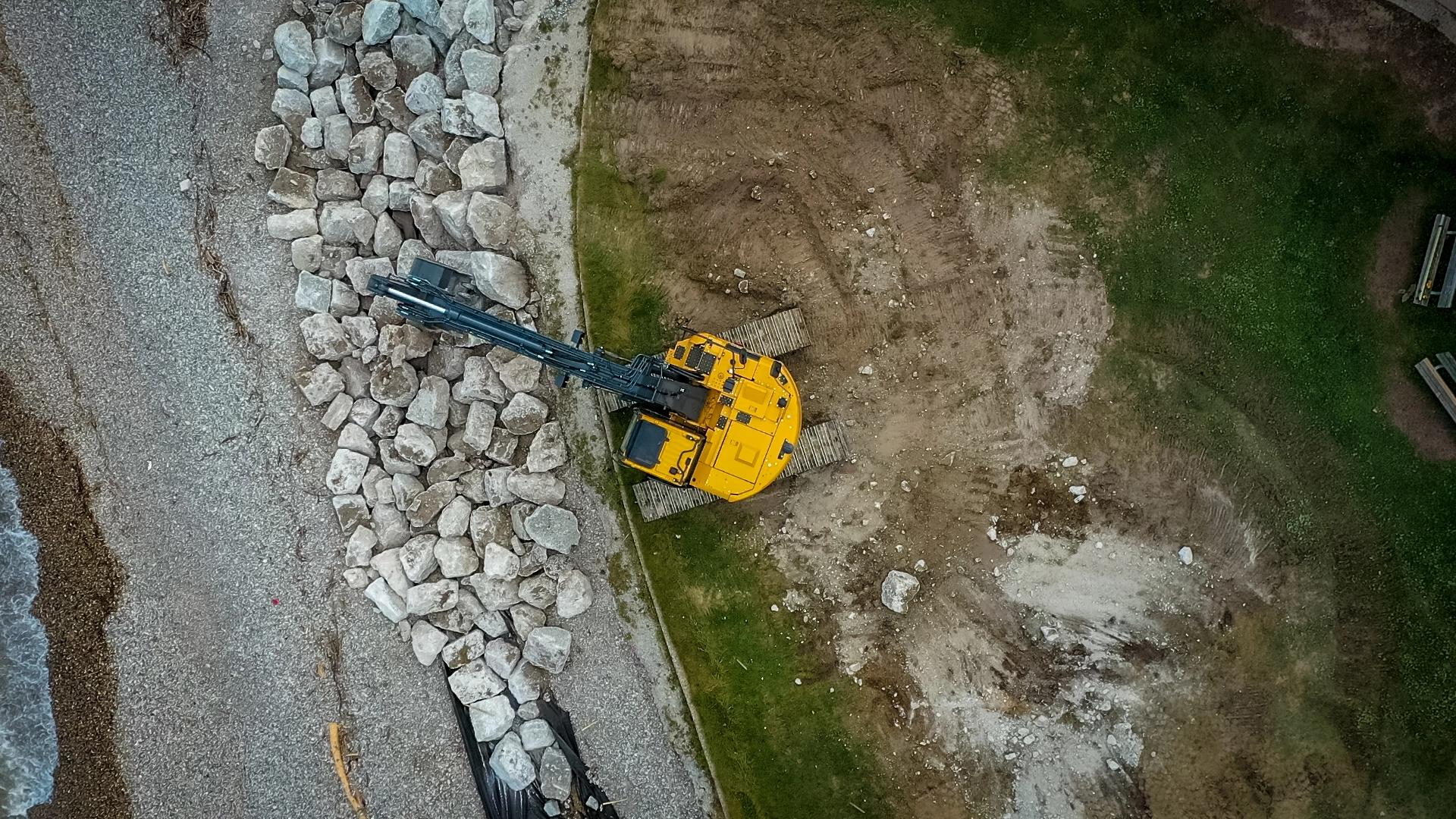 aerial view of excavator and rocks