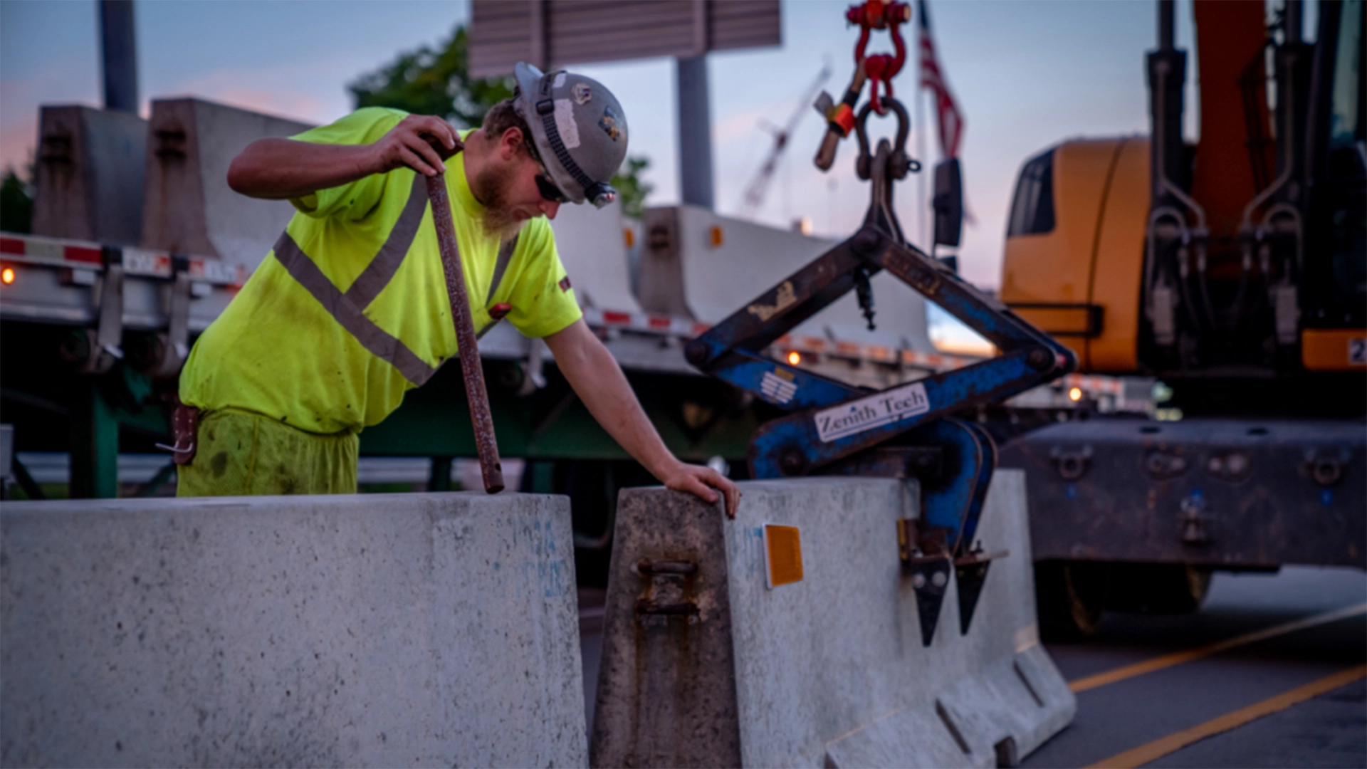 man moving concrete barriers
