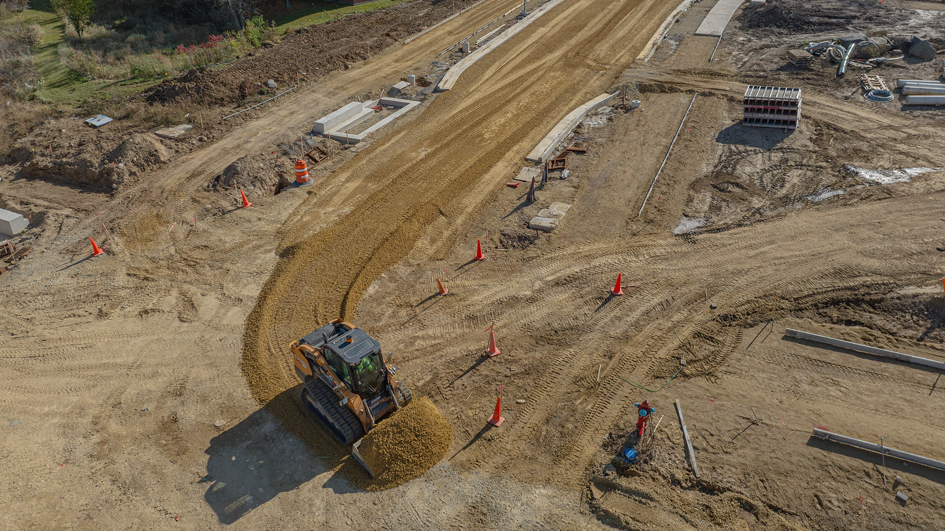 bobcat moving dirt on jobsite