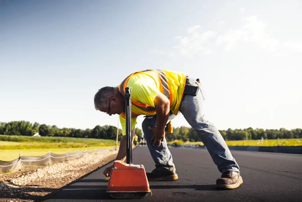 man working on blacktop