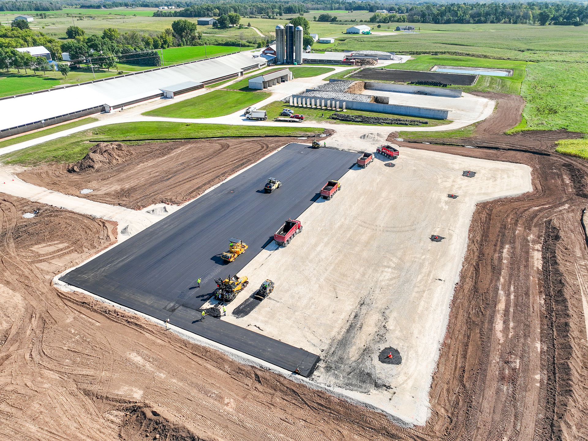 Drone view of asphalt application on Sunny Slope Dairy Reedsville, WI