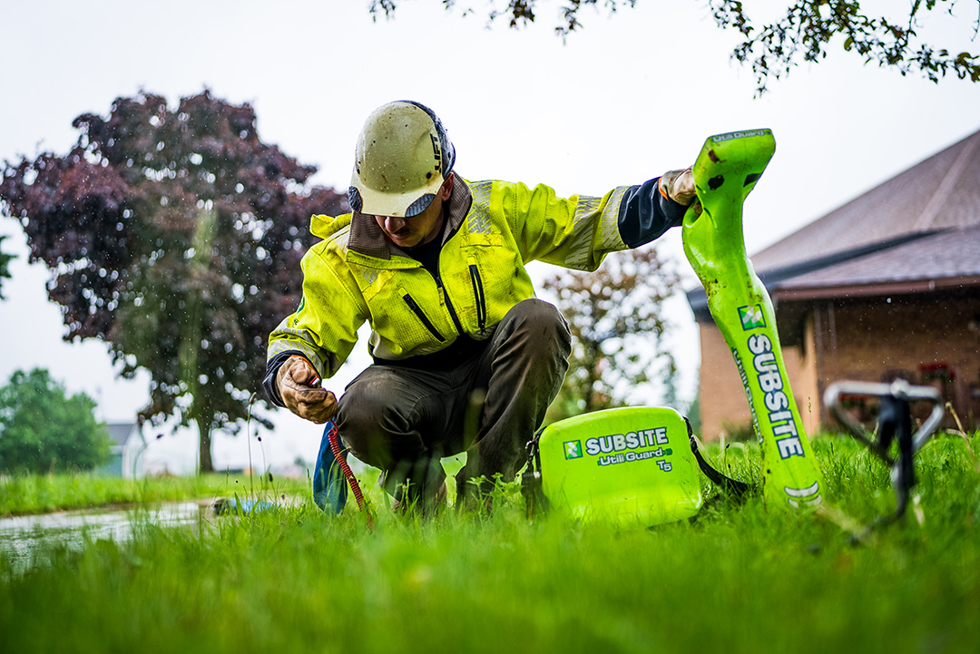Close up of worker collecting soil information before commencing Ishpeming Sewer project